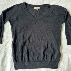 Black v-neck sweater. Very light wait.